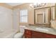 Full bathroom featuring a tiled shower/tub, toilet, and vanity with granite countertop at 7812 Wicklow Cir, Orlando, FL 32817