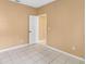 Bedroom with tile floors and neutral walls at 7812 Wicklow Cir, Orlando, FL 32817