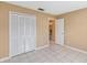 Bedroom with tile floors, neutral walls, and closet at 7812 Wicklow Cir, Orlando, FL 32817