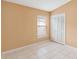 Bedroom with tile floors, window, and closet at 7812 Wicklow Cir, Orlando, FL 32817