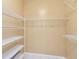 Walk-in closet with adjustable white wire shelving and neutral-colored walls at 7812 Wicklow Cir, Orlando, FL 32817