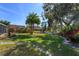 Landscaped backyard with stone path and lake view at 812 Edgeforest Ter, Sanford, FL 32771