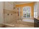 Spa-like bathroom with walk-in shower and soaking tub at 812 Edgeforest Ter, Sanford, FL 32771