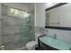 Clean bathroom with glass shower, modern vanity, and toilet at 812 Edgeforest Ter, Sanford, FL 32771