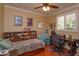 Cozy bedroom with built-in shelving, a daybed, and a workspace at 812 Edgeforest Ter, Sanford, FL 32771