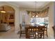 Casual breakfast nook with table and chairs, offering pool views at 812 Edgeforest Ter, Sanford, FL 32771