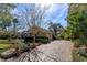 Elegant home with a paver driveway and lush landscaping at 812 Edgeforest Ter, Sanford, FL 32771