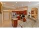 Well-equipped kitchen featuring granite countertops and rich wood cabinets at 812 Edgeforest Ter, Sanford, FL 32771