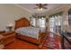 Large main bedroom with hardwood floors and pool view at 812 Edgeforest Ter, Sanford, FL 32771