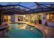 Inviting pool area at night with patio and seating at 812 Edgeforest Ter, Sanford, FL 32771