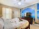 Bedroom with beach-themed mural and Parisian bedding at 8908 Legacy Ct # 201, Kissimmee, FL 34747