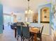 Bright dining room with beach mural and four chairs at 8908 Legacy Ct # 201, Kissimmee, FL 34747