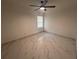 Bright bedroom with ceiling fan and marble-look floors at 9142 Sabal Palm Cir, Windermere, FL 34786