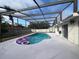 Inviting screened pool with patio and floats at 9142 Sabal Palm Cir, Windermere, FL 34786