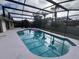 Screened-in pool with patio and two floats at 9142 Sabal Palm Cir, Windermere, FL 34786