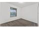 Simple bedroom with grey carpet and a large window at 11836 Language Way, Orlando, FL 32832