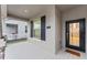 Modern front door with glass panels and a welcoming mat at 11836 Language Way, Orlando, FL 32832