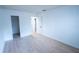 Empty bedroom featuring updated laminate floors and freshly painted walls at 100 El Camino Dr # 102, Winter Haven, FL 33884