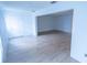 Bright living room has a neutral color scheme with light wood flooring at 100 El Camino Dr # 102, Winter Haven, FL 33884