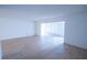 Bright living room offers lots of space and light wood flooring at 100 El Camino Dr # 102, Winter Haven, FL 33884