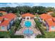 This aerial view highlights the pool and splash pad between the buildings at 1068 Park Ridge Cir, Kissimmee, FL 34746