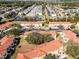 Aerial view of a residential community featuring well-manicured landscapes and scenic ponds at 1068 Park Ridge Cir, Kissimmee, FL 34746