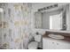 Bright bathroom featuring a shower-tub combination with a decorative floral shower curtain at 1068 Park Ridge Cir, Kissimmee, FL 34746