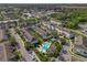 Aerial view of townhouses and community pool with palm trees at 1076 Taramundi Dr, Oviedo, FL 32765