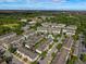 Aerial view of townhouses with a community pool and lush landscaping at 1076 Taramundi Dr, Oviedo, FL 32765