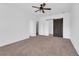 Spacious bedroom with carpeted floor and barn door at 1076 Taramundi Dr, Oviedo, FL 32765