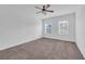 Bright bedroom with ceiling fan and neutral carpeting at 1076 Taramundi Dr, Oviedo, FL 32765