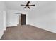 Spacious bedroom with carpeted floors and barn door at 1076 Taramundi Dr, Oviedo, FL 32765