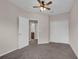 Spacious bedroom with ceiling fan and private bathroom access at 1076 Taramundi Dr, Oviedo, FL 32765