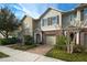 Two-story townhouse with attached garage and landscaping at 1076 Taramundi Dr, Oviedo, FL 32765