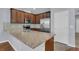 Kitchen features granite countertops and dark wood cabinets at 1076 Taramundi Dr, Oviedo, FL 32765