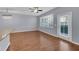 Spacious living room with hardwood floors and sliding glass door at 1076 Taramundi Dr, Oviedo, FL 32765