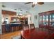 Open concept dining room with hardwood floors and kitchen view at 1107 Seafarer Ln, Winter Springs, FL 32708