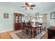 Dining room with hardwood floors, ceiling fan, and built-in hutch at 1107 Seafarer Ln, Winter Springs, FL 32708