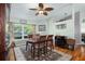 Bright dining room featuring hardwood floors and a ceiling fan at 1107 Seafarer Ln, Winter Springs, FL 32708