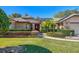 Front view of charming brick home with lush landscaping and a welcoming entrance at 1107 Seafarer Ln, Winter Springs, FL 32708