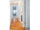 Light hardwood hallway with access to bedrooms and bathroom at 1107 Seafarer Ln, Winter Springs, FL 32708