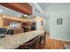 Kitchen with granite counters, wood cabinets, and breakfast bar at 1107 Seafarer Ln, Winter Springs, FL 32708