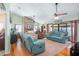 Bright living room featuring hardwood floors, two sofas, and sliding doors to a patio at 1107 Seafarer Ln, Winter Springs, FL 32708