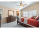 Large main bedroom with high ceiling, dresser, and ensuite bathroom access at 1107 Seafarer Ln, Winter Springs, FL 32708