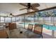 Covered patio overlooking refreshing pool with seating at 1107 Seafarer Ln, Winter Springs, FL 32708