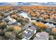 Aerial view showcasing a house in a neighborhood with a lake at 11401 Camden Park Dr, Windermere, FL 34786