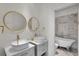 Elegant bathroom with double sinks, freestanding tub, and marble tile at 11401 Camden Park Dr, Windermere, FL 34786