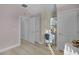 Light and airy bedroom with a desk and ample closet space at 11401 Camden Park Dr, Windermere, FL 34786