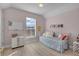 Cozy bedroom featuring a daybed and built-in shelving at 11401 Camden Park Dr, Windermere, FL 34786