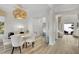 Elegant dining room with white table, chairs, and chandelier at 11401 Camden Park Dr, Windermere, FL 34786